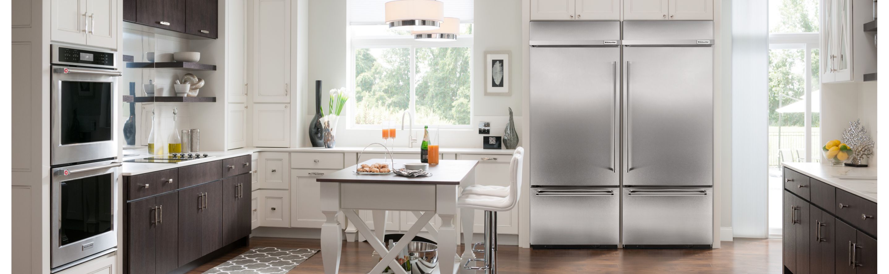 Kitchen with KitchenAid® stainless steel appliances and white cabinets
