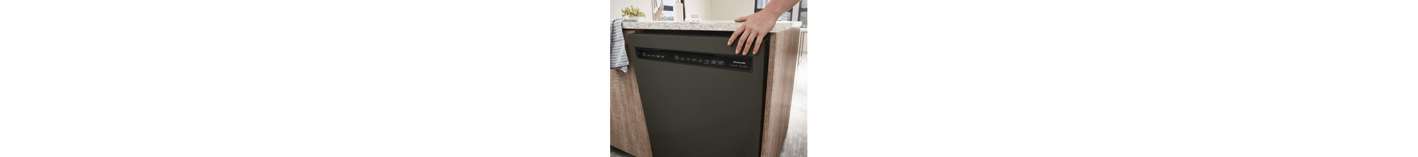 KitchenAid® front control dishwasher with pocket handle built into an island