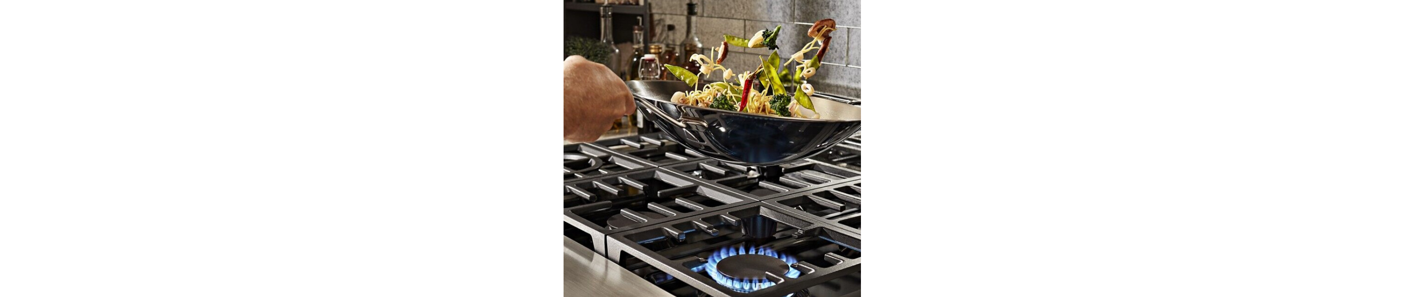 Vegetables being stir fried in a wok