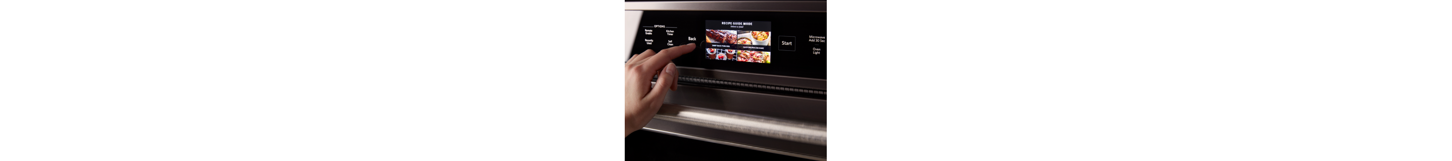 Person selecting settings on the digital display of an oven 