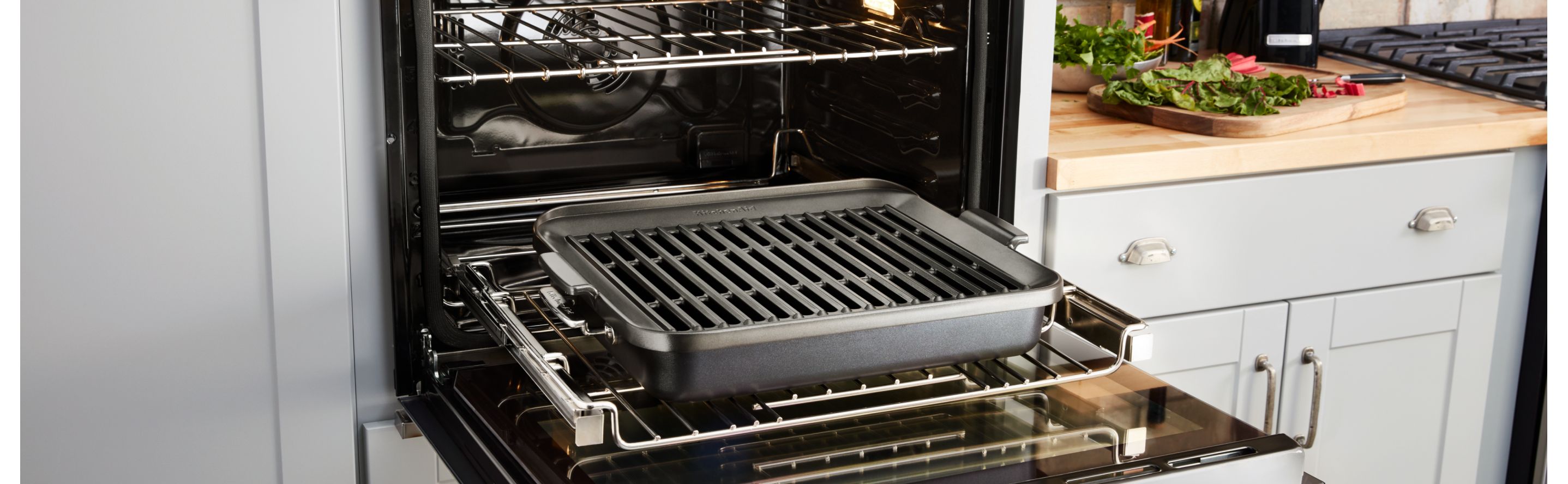 An open wall oven in a modern kitchen