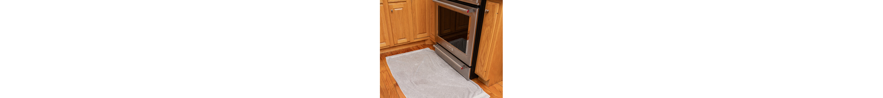 A pulled back image of oven door glass on an oven