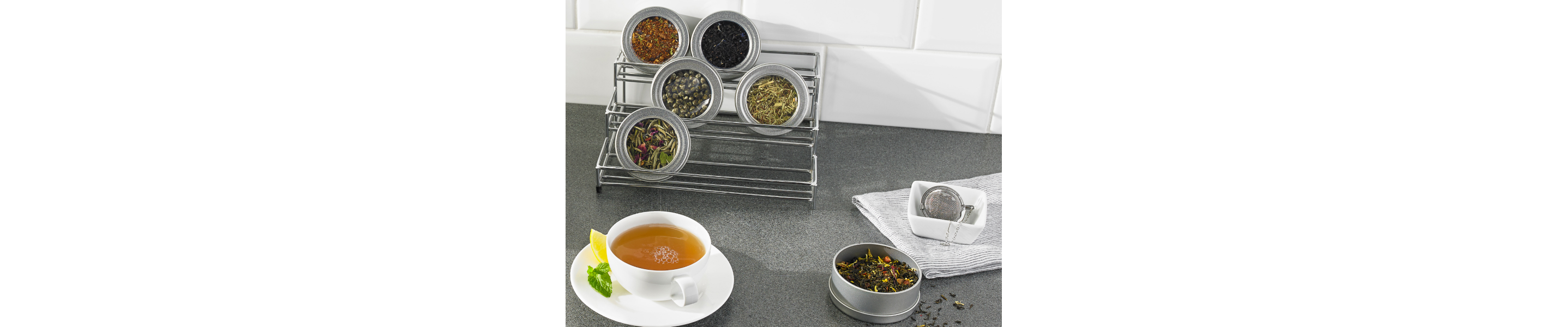 Hot tea and various loose tea leaves