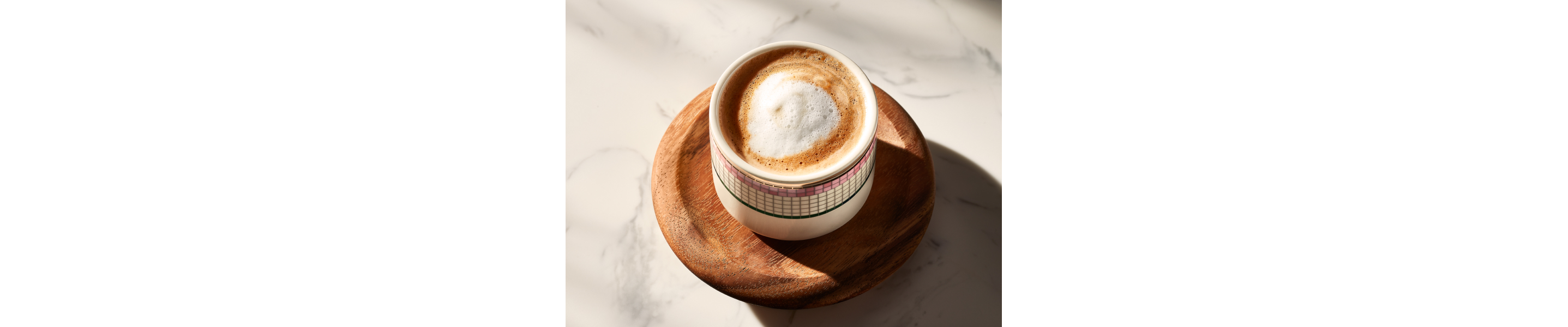 An espresso con panna in an ornate coffee cup