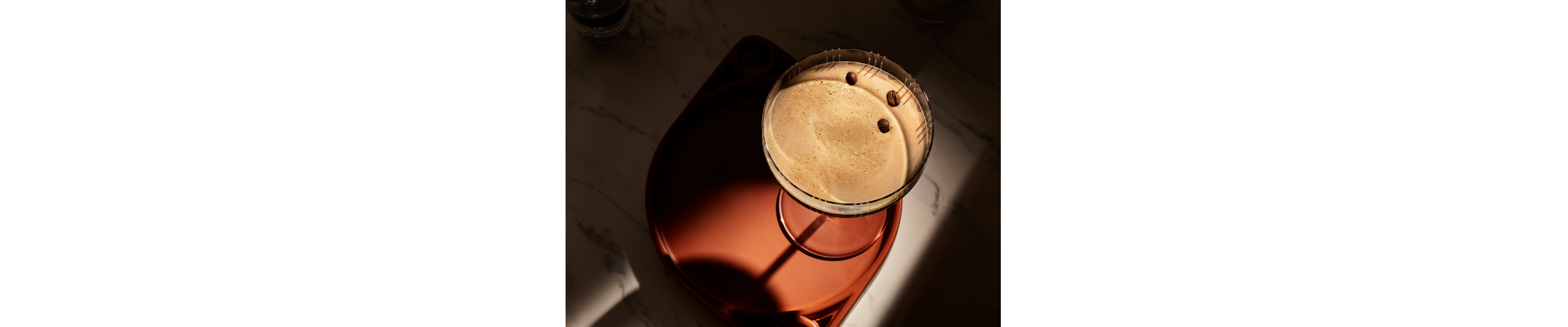 Birds-eye view of an espresso martini on a serving tray