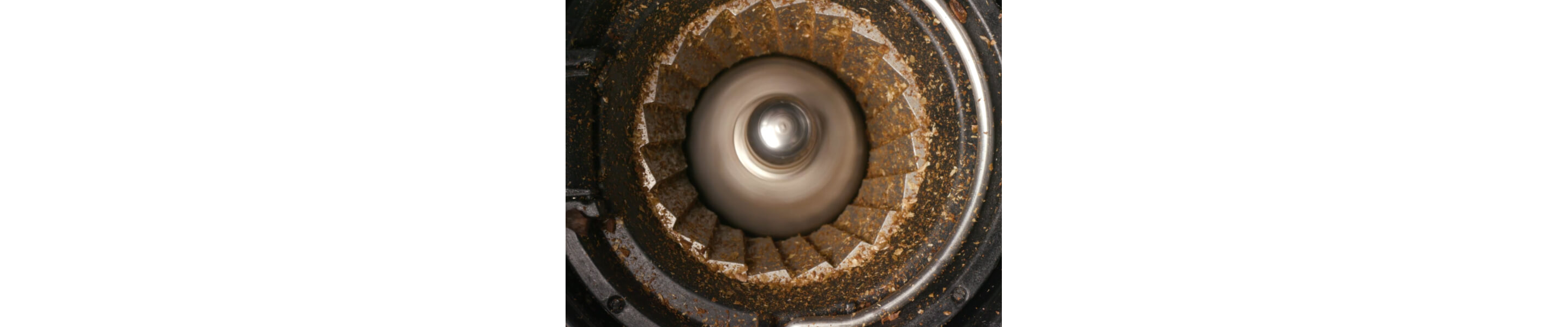 Closeup image of a coffee bean grinder