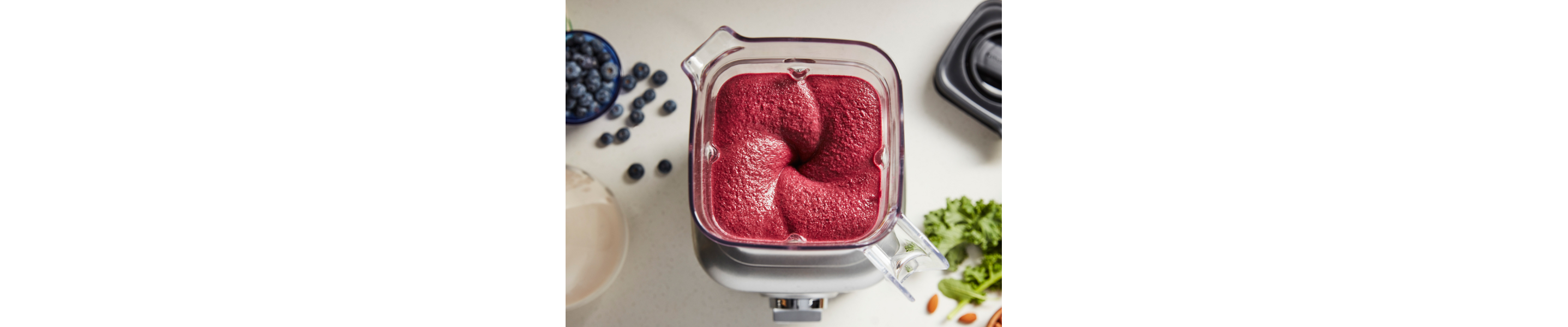  A red purée mixture in a blender.