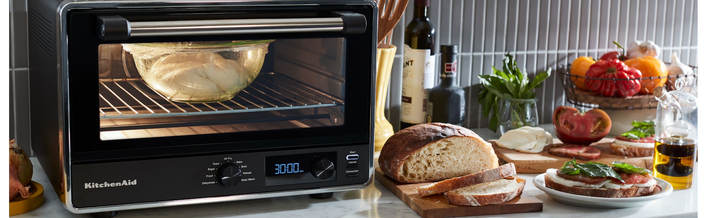 Different foods next to a countertop oven