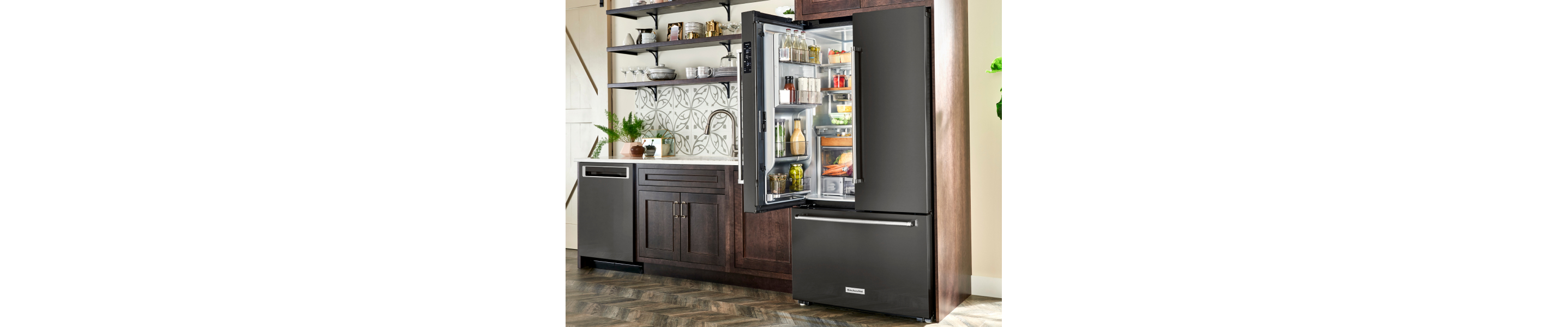 Open French door refrigerator with food inside