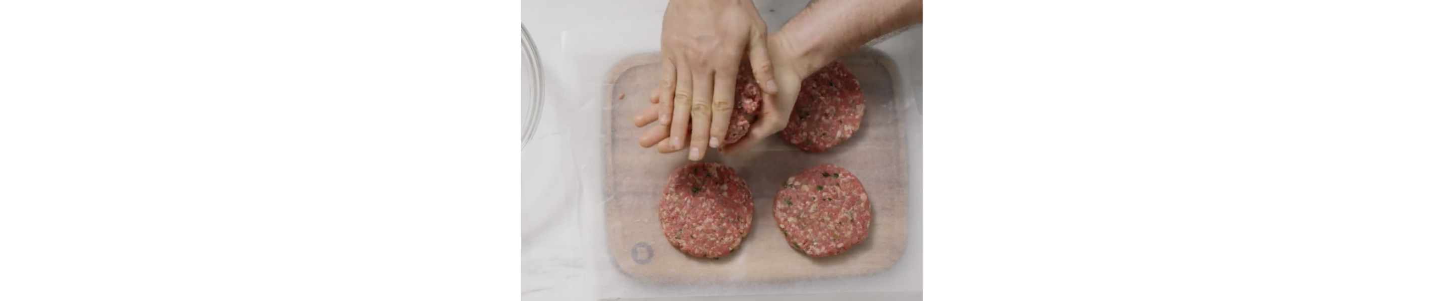 Person forming four patties from ground beef