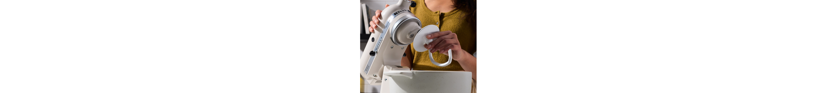 Maker affixing Dough Hook Accessory to KitchenAid® stand mixer