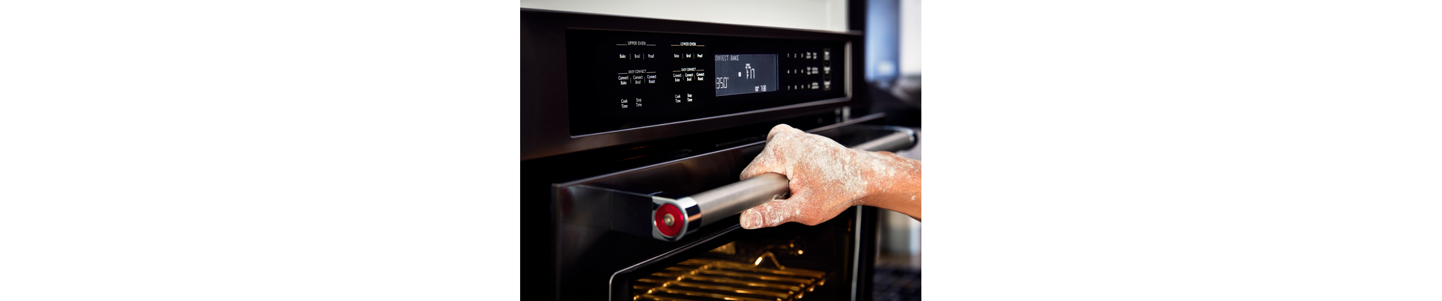 A person holding opening an oven