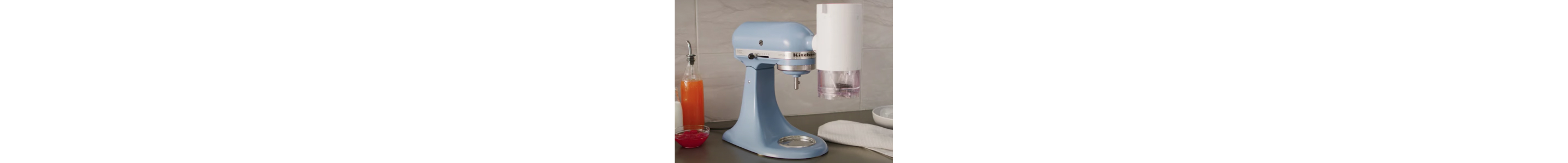 A KitchenAid® stand mixer with Shave Ice Attachment