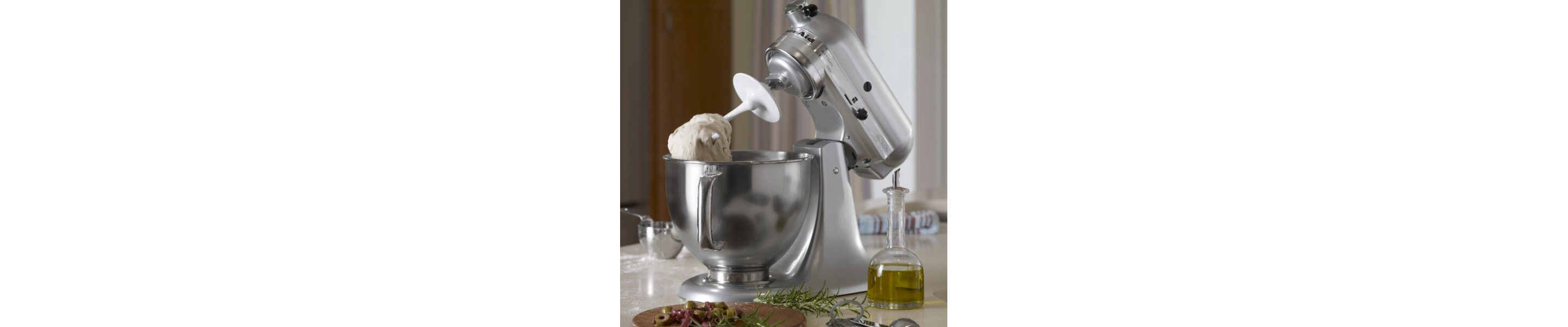 Silver KitchenAid® tilt-head stand mixer with dough on the dough hook