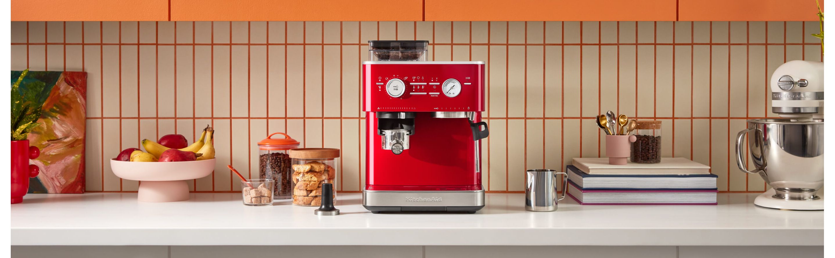 Red KitchenAid® semi-automatic espresso machine on a kitchen counter