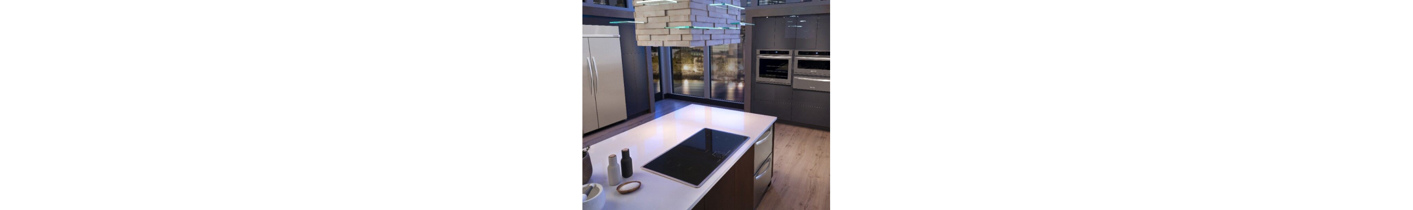 Custom range hood above an island range in a kitchen