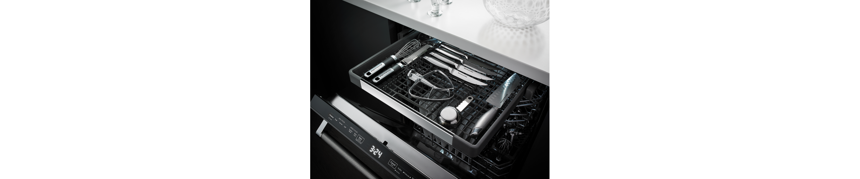 Knives and various utensils in third rack of dishwasher