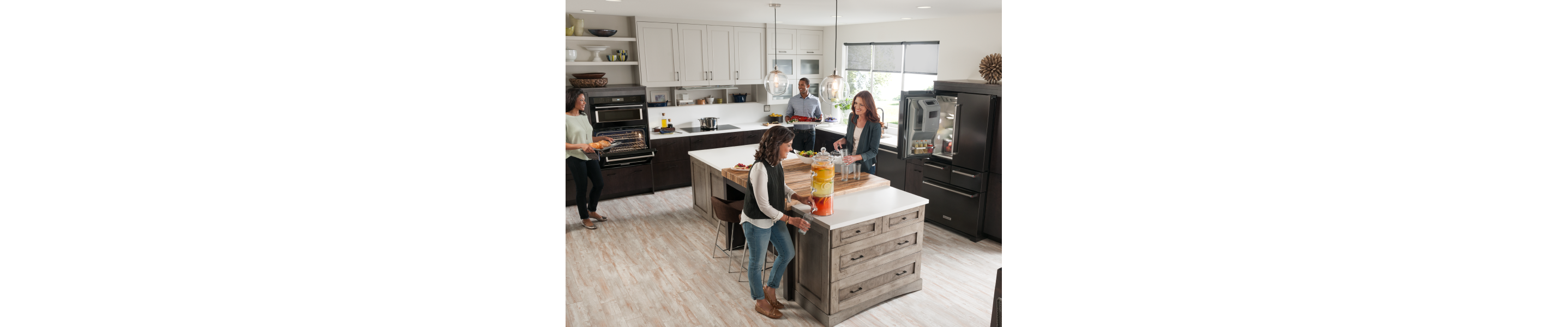 People gathering and cooking in an open concept kitchen