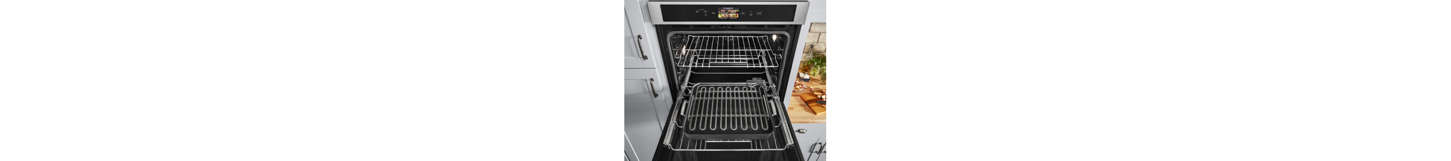 An opened KitchenAid® wall oven