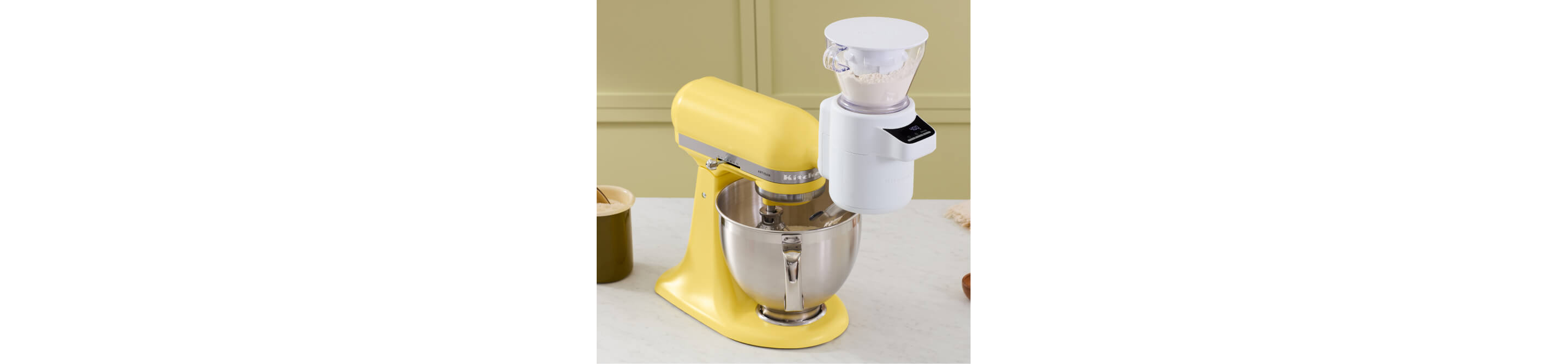 The Butter stand mixer with the flour sifter attachment.