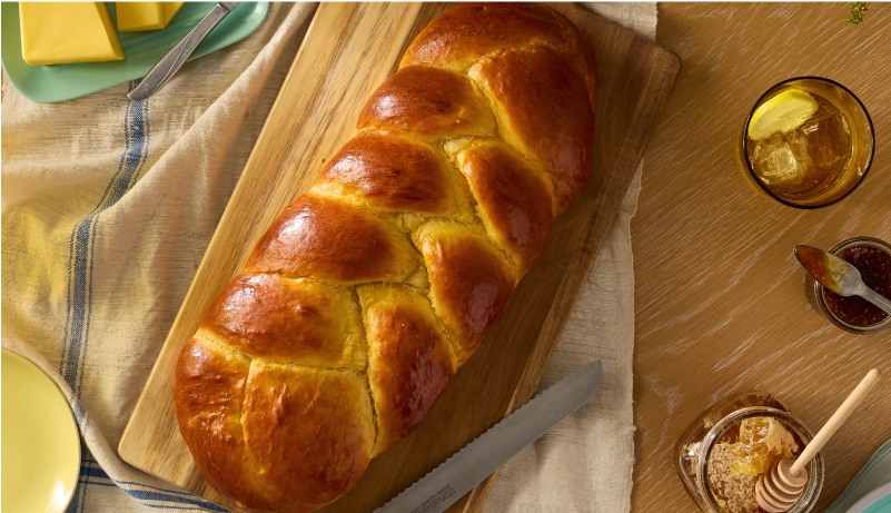 A loaf of braided brioche bread.