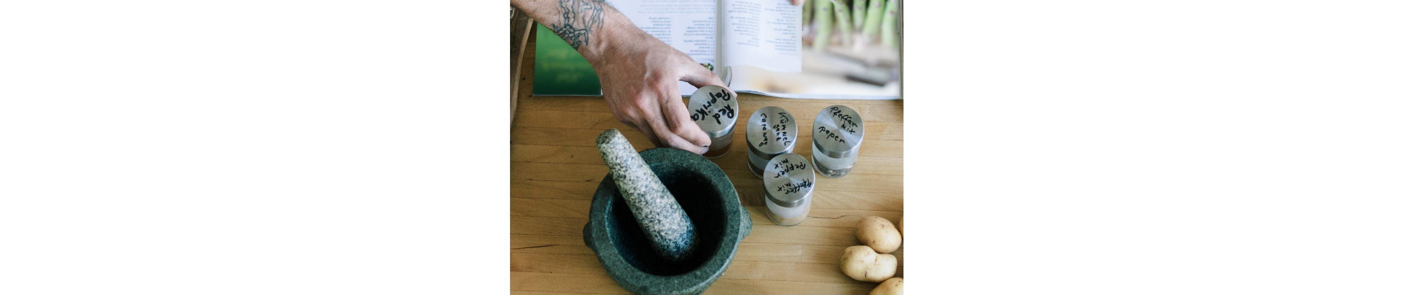 A person adding ingredients to a bowl