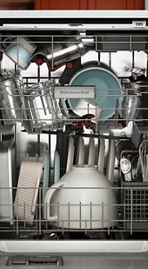 An open dishwasher with dishes inside.