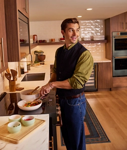 Chef Antoni Porowski prepping a dish at Room to Host