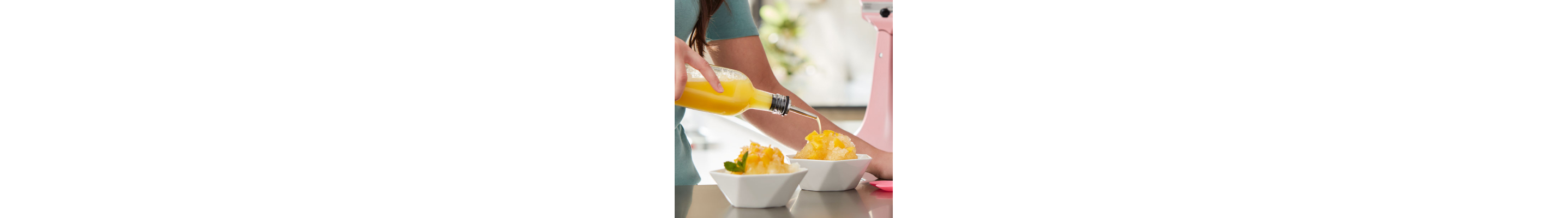 Mango Hawaiian shave ice next to a pink KitchenAid® stand mixer