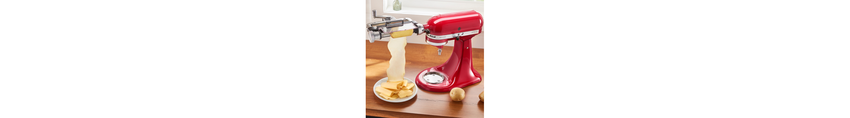 Red KitchenAid® stand mixer with Vegetable Sheet Cutter Attachment