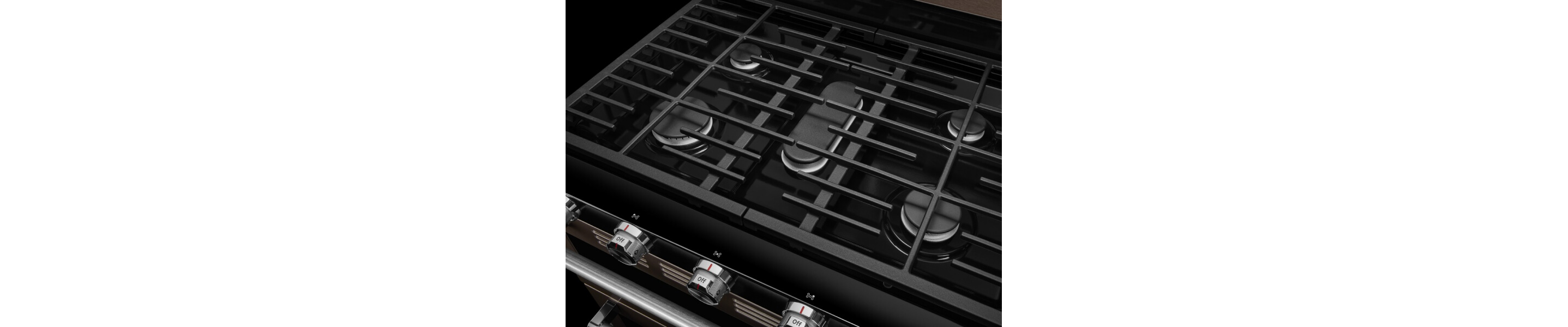 Close-up of a gas cooktop with steel grates
