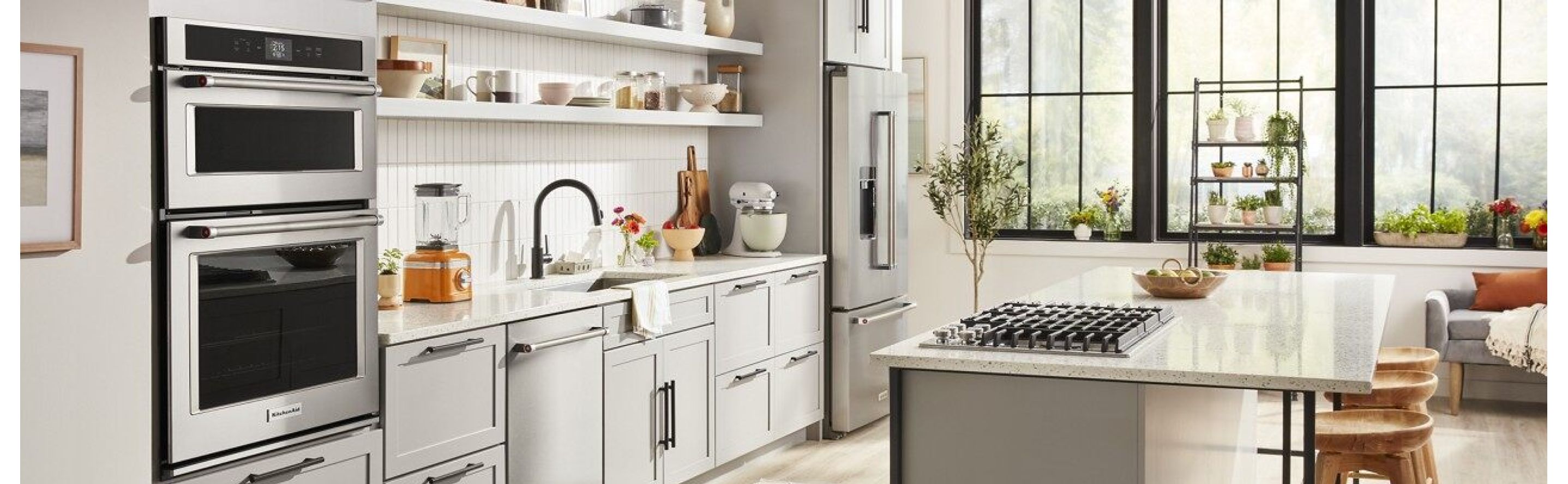 KitchenAid® appliances in a black and white themed kitchen.