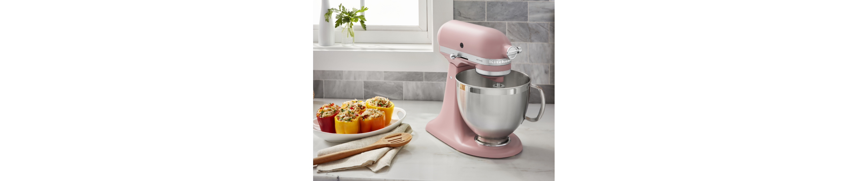 KitchenAid® stand mixer on countertop with stuffed bell peppers