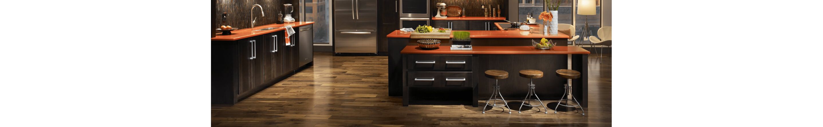 Open concept kitchen with kitchen island and counter stools