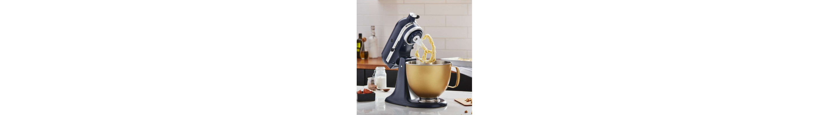 Black KitchenAid® stand mixer with gold stand mixer bowl full of batter