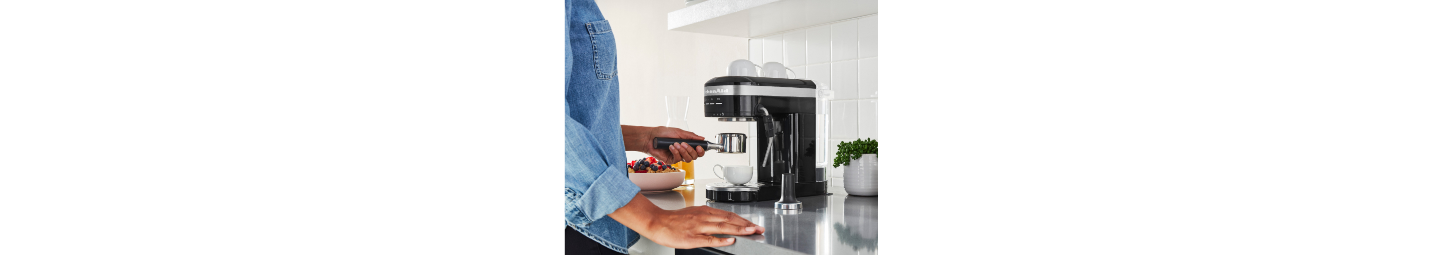 Woman using an espresso maker