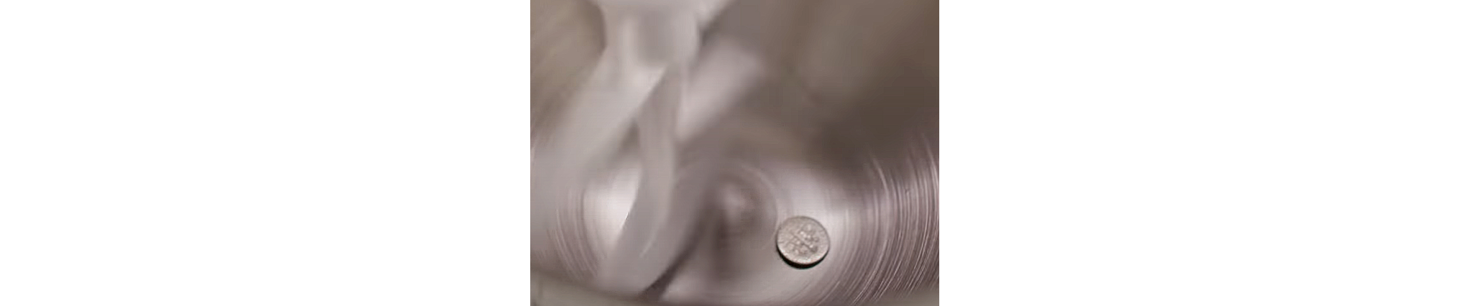 A dime in a stand mixer bowl