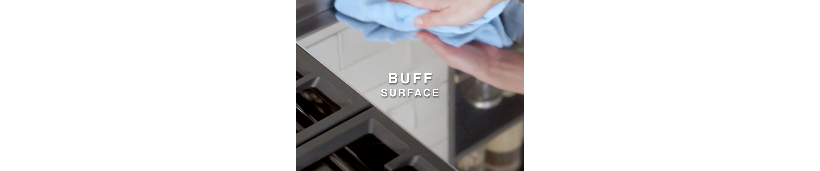 Person wiping griddle with clean microfiber cloth 