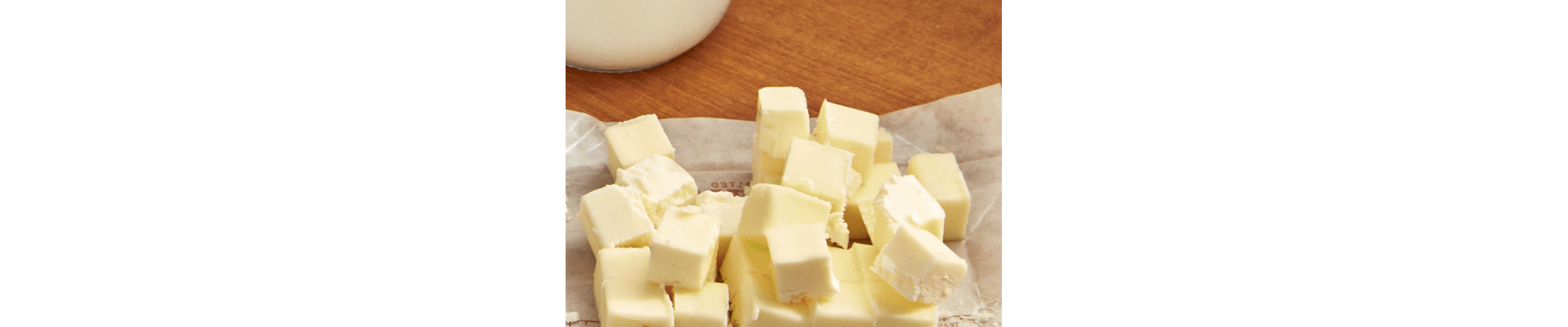 Cubed butter on top of a butter wrapper