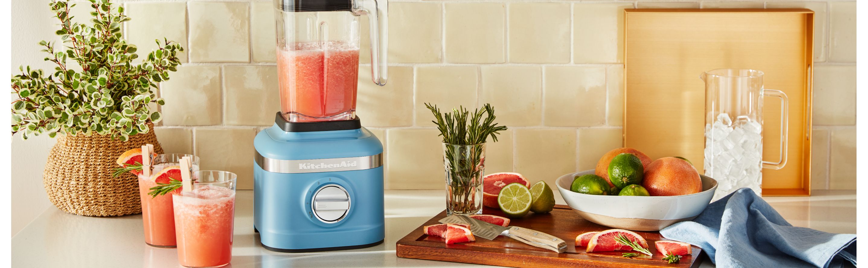 Slushie ingredients on a counter next to a blender