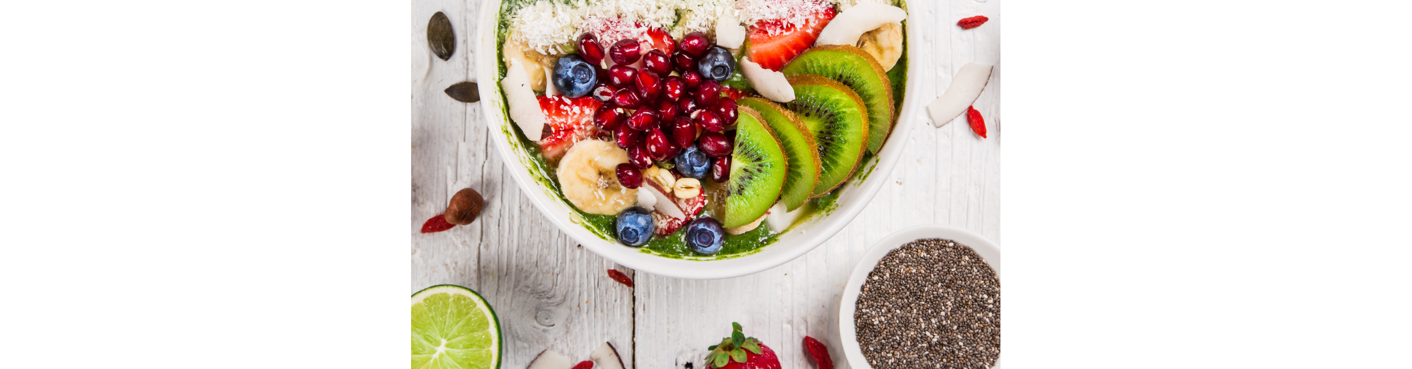 Smoothie bowl topped with a variety of fresh fruits