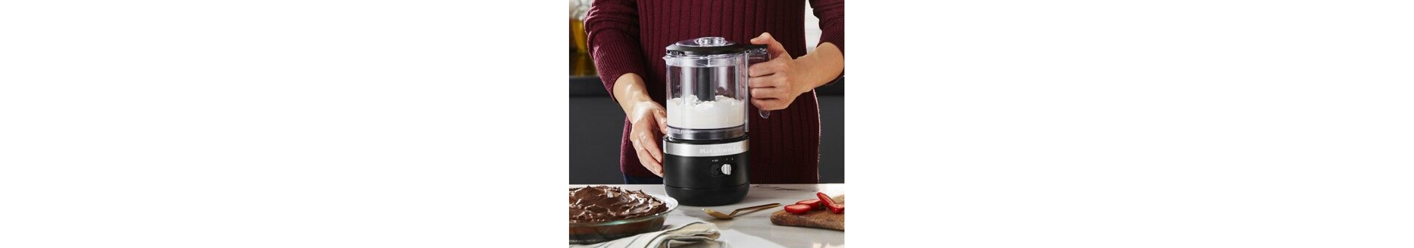 Woman whipping cream with black KitchenAid® food chopper