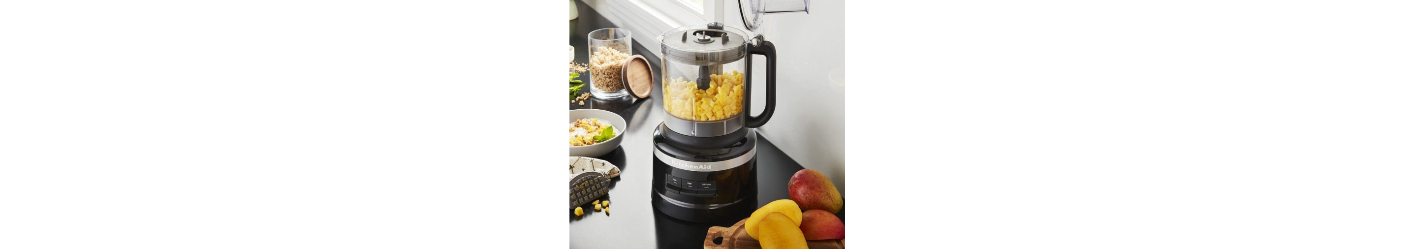 Diced mango in black KitchenAid® food processor for baby food snacks