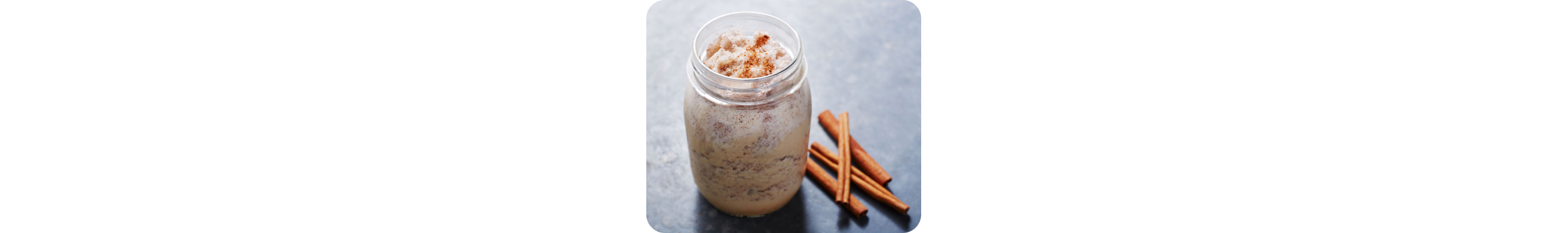 Mason jar filled with cold brew coffee recipe and cinnamon sticks