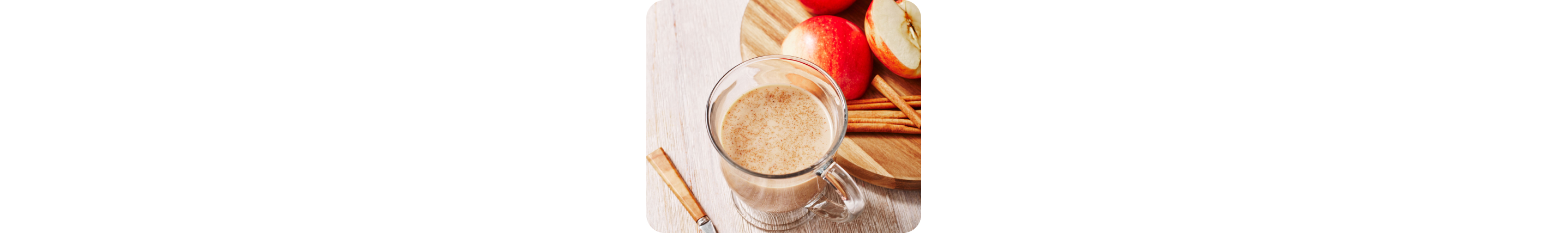 Glass of hot cold brew latte with apples