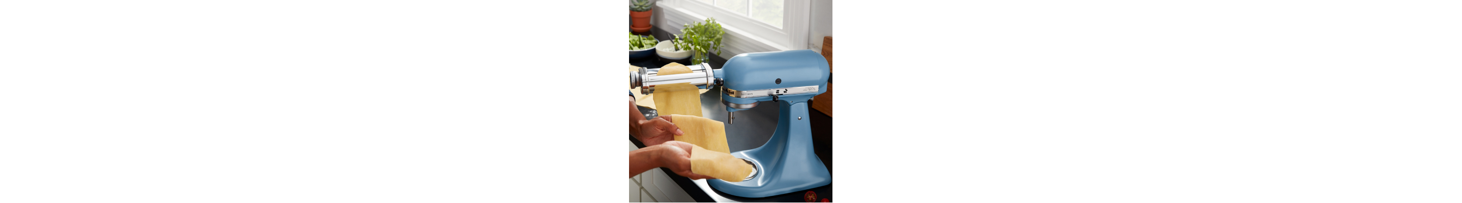  KitchenAid® stand mixer with KitchenAid® Roller Attachment making rolling out sheet of pasta