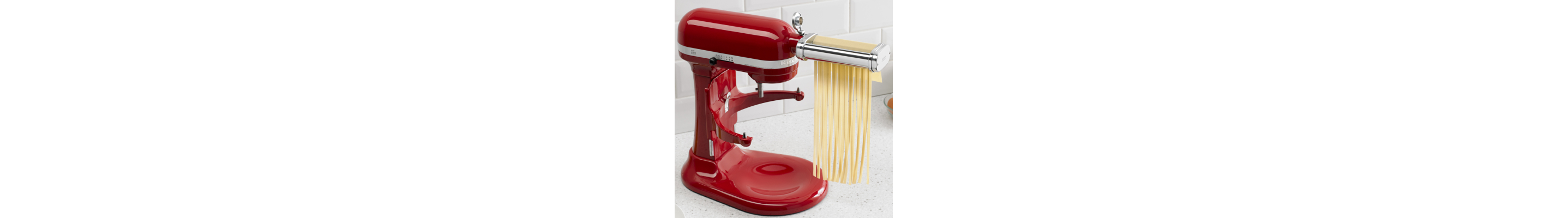 KitchenAid® stand mixer with KitchenAid® Cutter Attachment cutting fresh pasta into strands