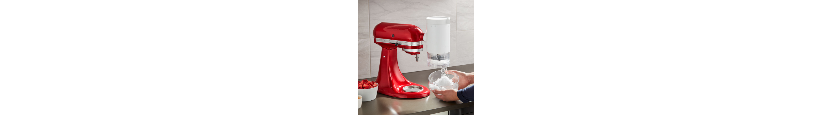 A red KitchenAid® Stand Mixer with Shave Ice Attachment.
