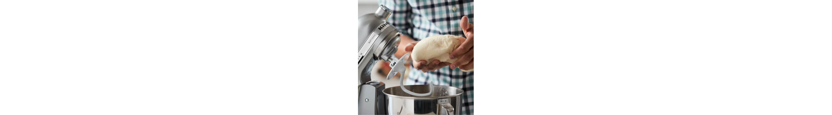 Dough being removed from bowl of KitchenAid® stand mixer