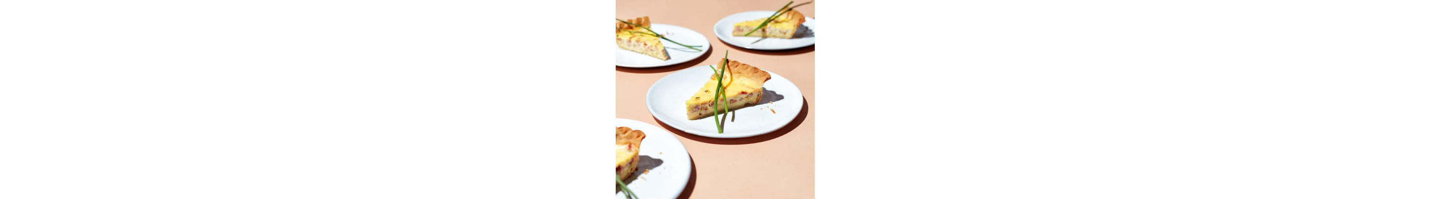 Three plates of deep dish ham quiche from Yummly recipe